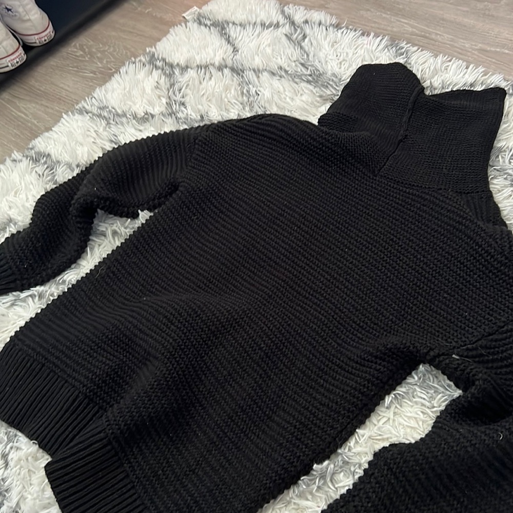Black turtle neck sweater
